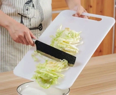 Picture of White Cutting Board. Board For Vegetable Cutting in kitchen