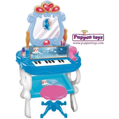 Picture of Frozen Piano & Princess Vanity REIG Piano and Beauty Vanity from the Disney Frozen movie that includes game accessories such as lipstick, nail polish, rings and bracelets.