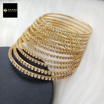 Picture of Golden Metal & White Stone Bangles for Women 12 Pieces (Imported) M-ST2200GOLDWHITE - Bangles