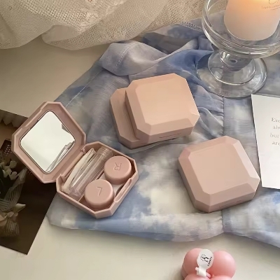 Picture of New Portable Pink Diamond Shape Contact lences Box Holder with Tweezers Remover Tool Solution Bottle Kit for Daily Outdoor Use,tour & travel. New design and Authentic quality Travel Kit Of all type Of Contact lens. #diamondkit