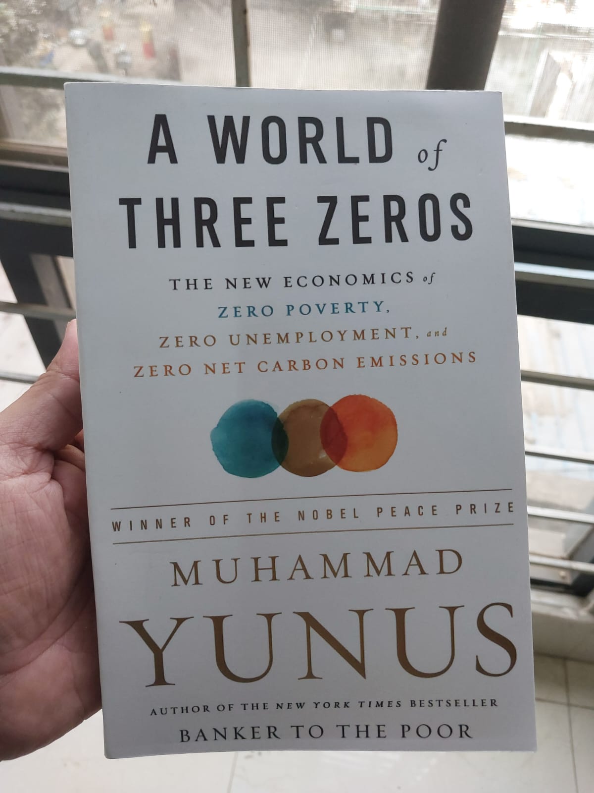 Picture of A World of Three Zeros by Muhammad Yunus (Premium Quality - Paperback)