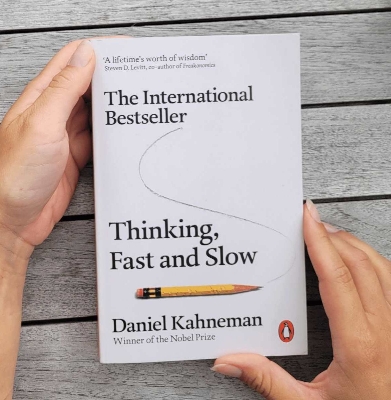 Picture of Thinking, Fast and Slow by Daniel Kahneman (Yellow Page Paperback)