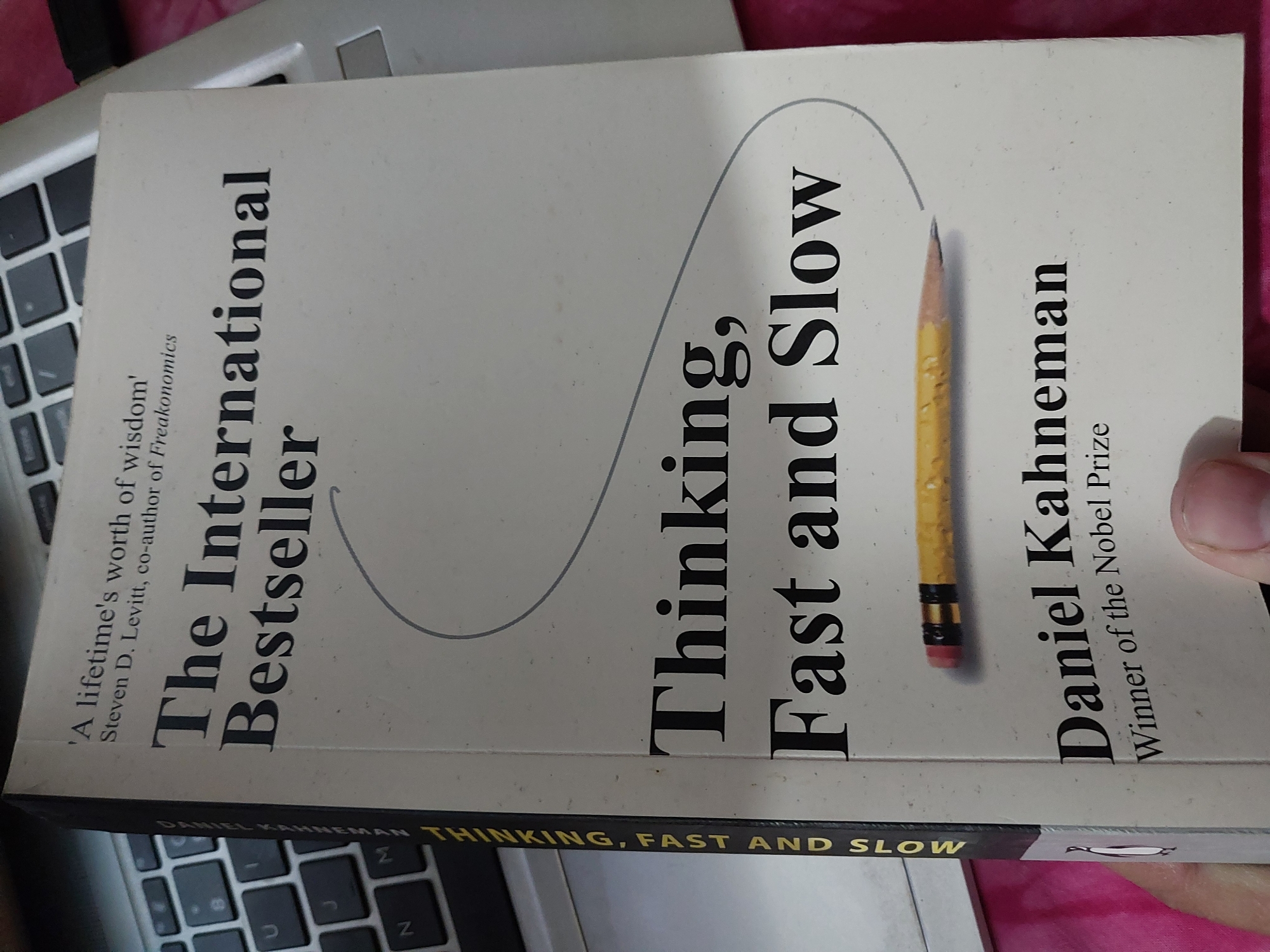 Picture of Thinking, Fast and Slow by Daniel Kahneman (Yellow Page Paperback)