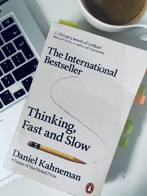 Picture of Thinking, Fast and Slow by Daniel Kahneman (Yellow Page Paperback)