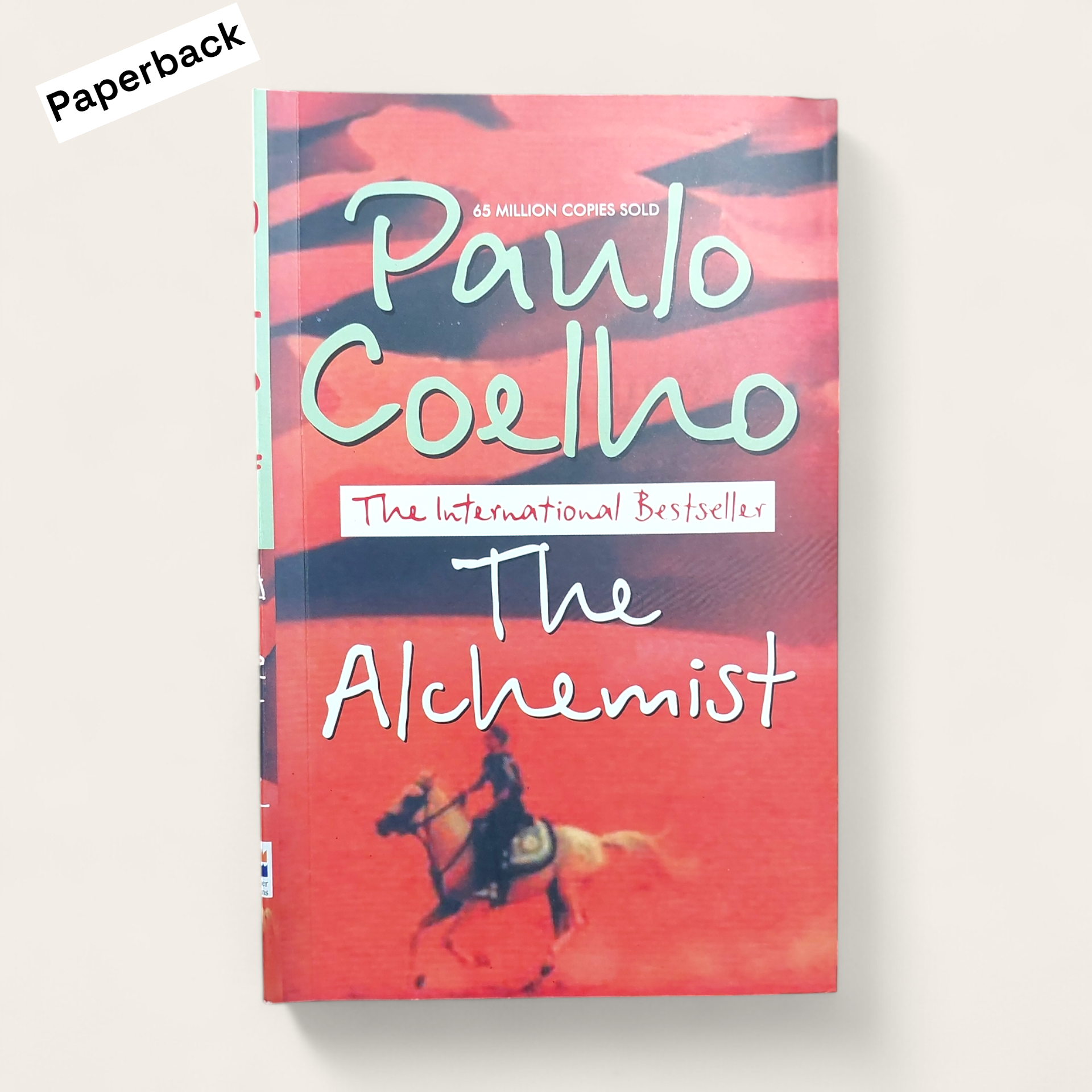 Picture of The Alchemist Novel by Paulo Coelho (Yellowish -Paperback)