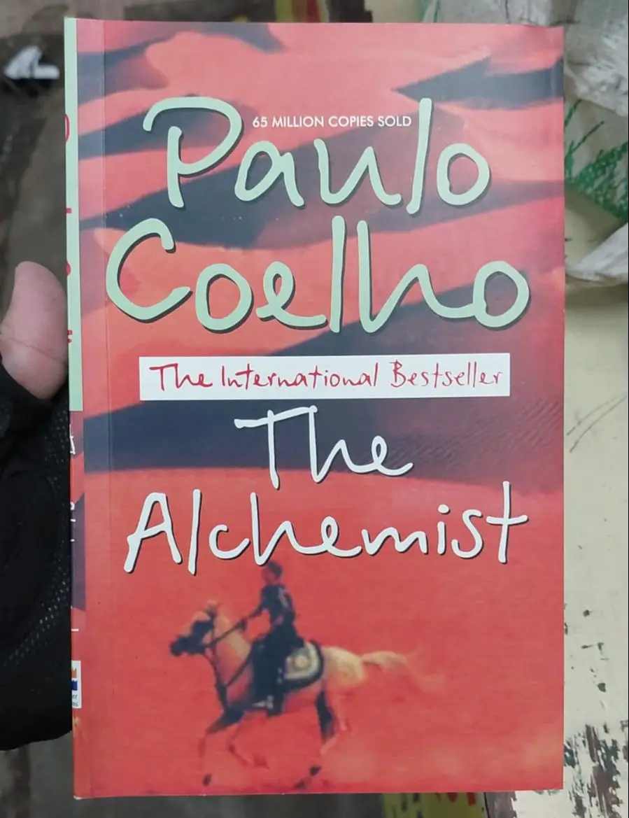 Picture of The Alchemist Novel by Paulo Coelho (Yellowish -Paperback)