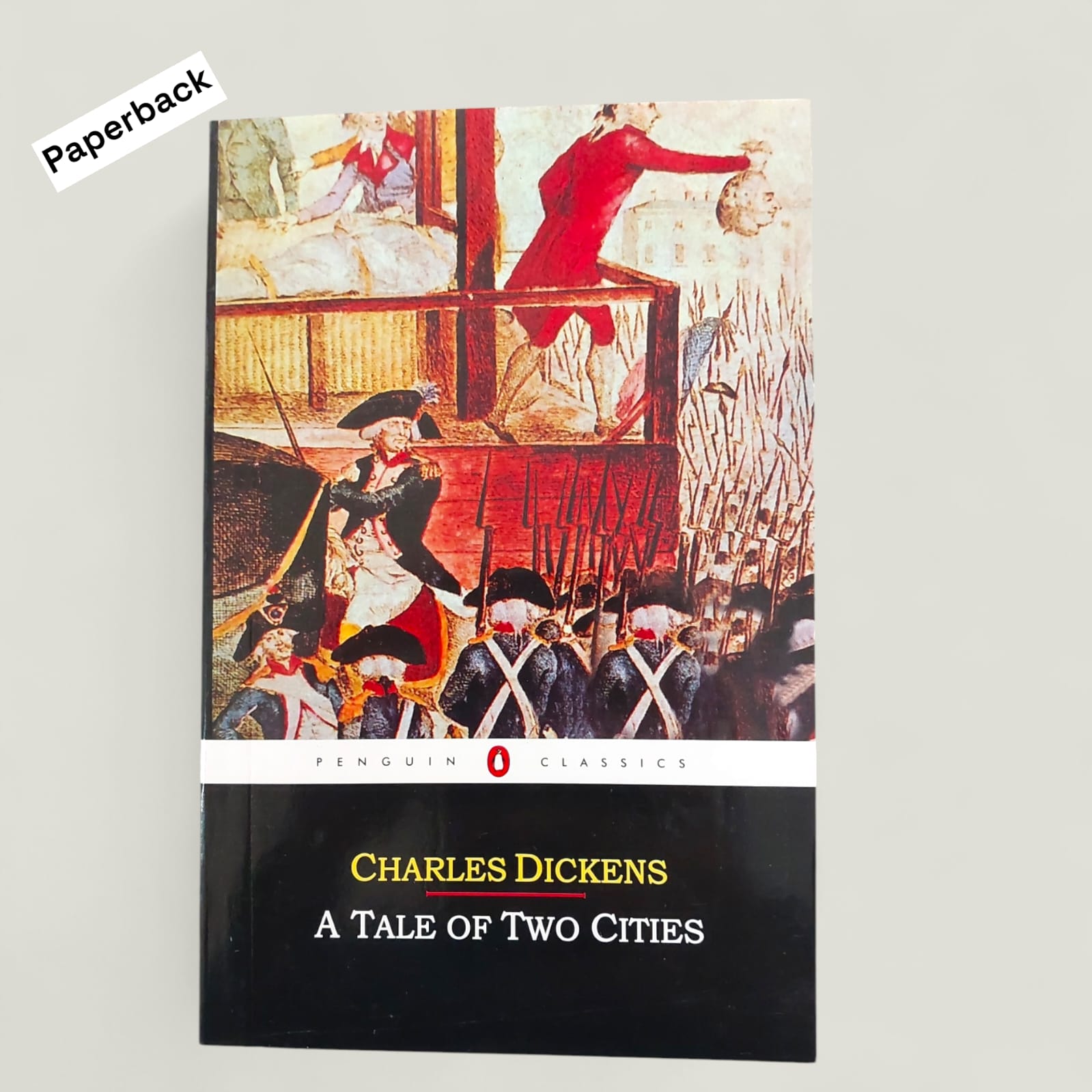 Picture of A Tale of Two Cities Novel by Charles Dickens (Yellowish - Paperback)