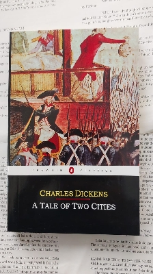Picture of A Tale of Two Cities Novel by Charles Dickens (Yellowish - Paperback)