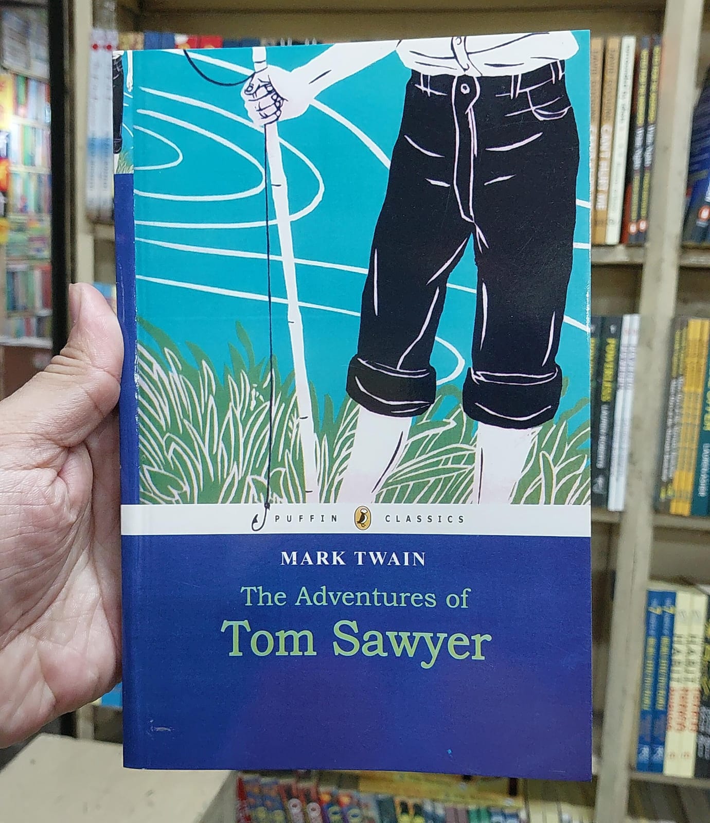 Picture of The Adventures of Tom Sawyer (Puffin Classics) by Mark Twain (Yellowish - Paperback)