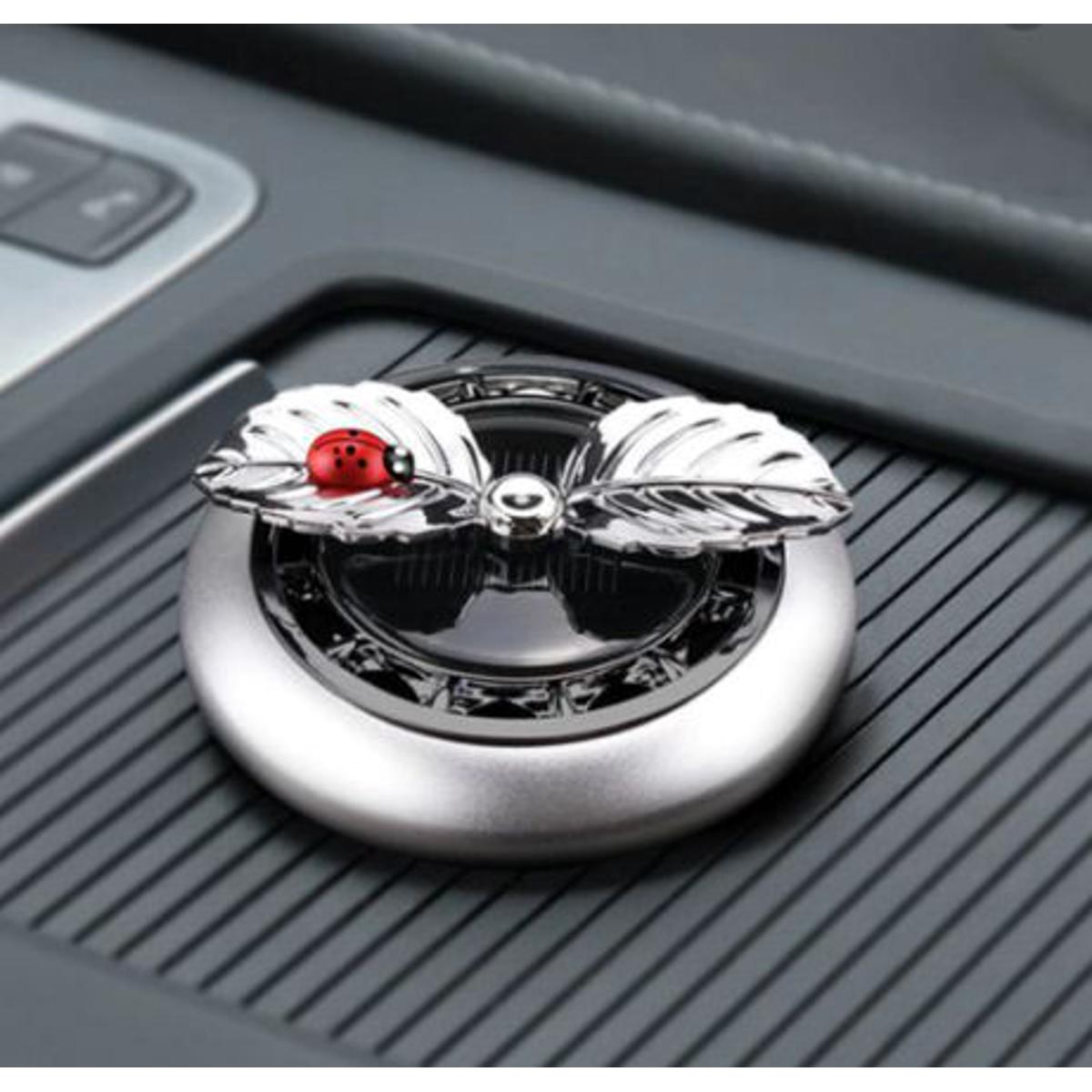 Picture of Car Perfume Ornaments Creative Solar Rotation Leaf Car Aromatherapy Air Fresher Alloy Fragance Diffuser Car Decoration