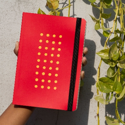 Picture of Daily Journal Red (Punch-Yellow) Dotted Grid Notebook with Elastic Band