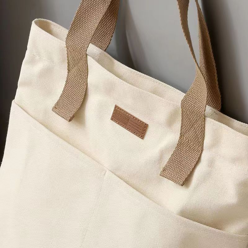 Picture of TAG Lifestyle Canvas Tote Bag/Fashionable Top Handle Off White Color With 2 Big Outside Pocket and Zipper Enclosure for girls For University/College/Trendy Fashionable Women