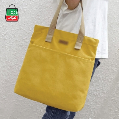 Picture of TAG Lifestyle Canvas Tote Bag/Fashionable Top Handle Golden Yellow Color With 2 Big Outside Pocket and Zipper Enclosure for girls For University/College/Trendy Fashionable Women