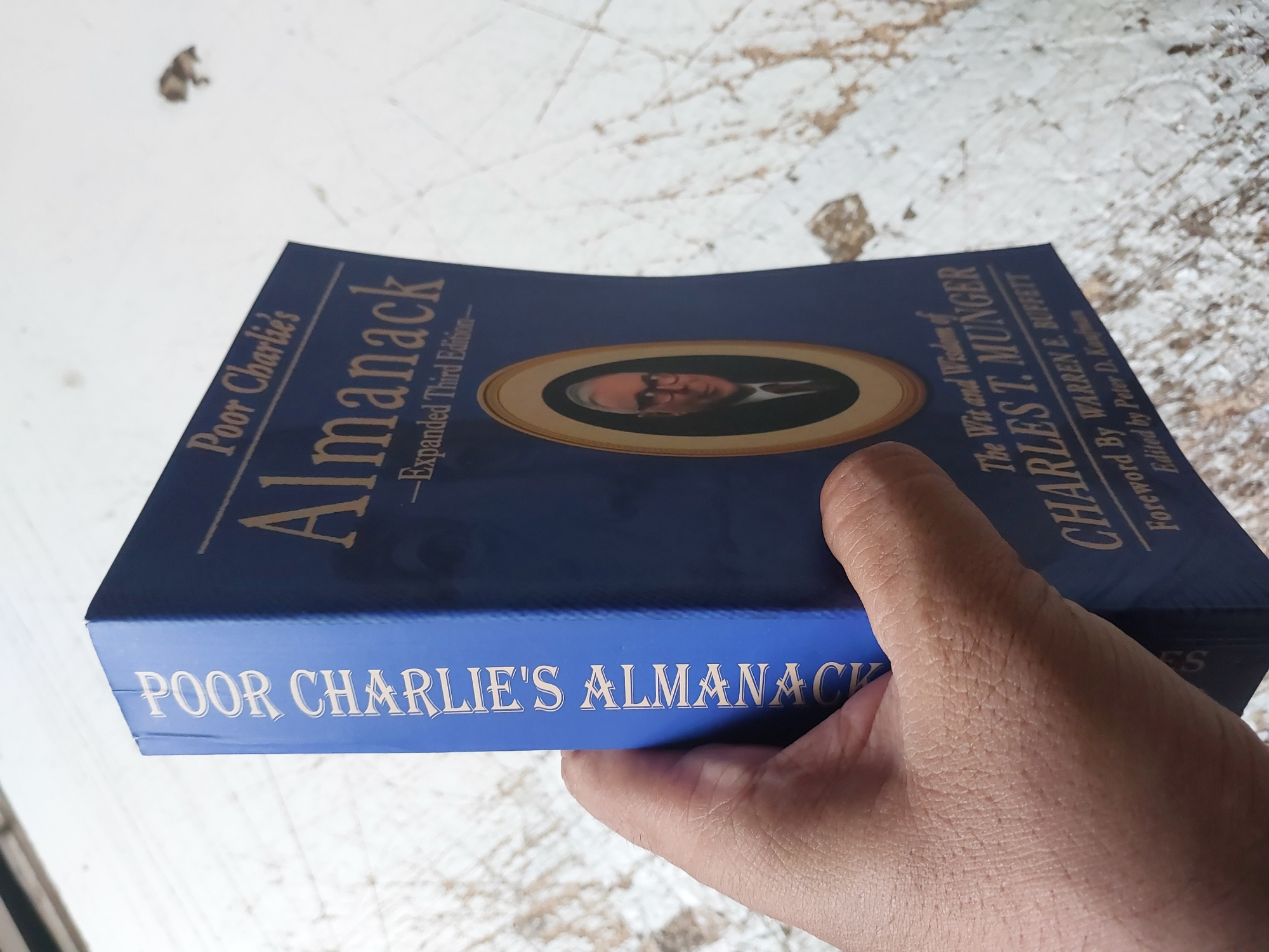 Picture of Poor Charlie's Almanack: The Wit and Wisdom of Charles T. Munger, Expanded Third Edition by Charlie Munger - Premium - Paperback