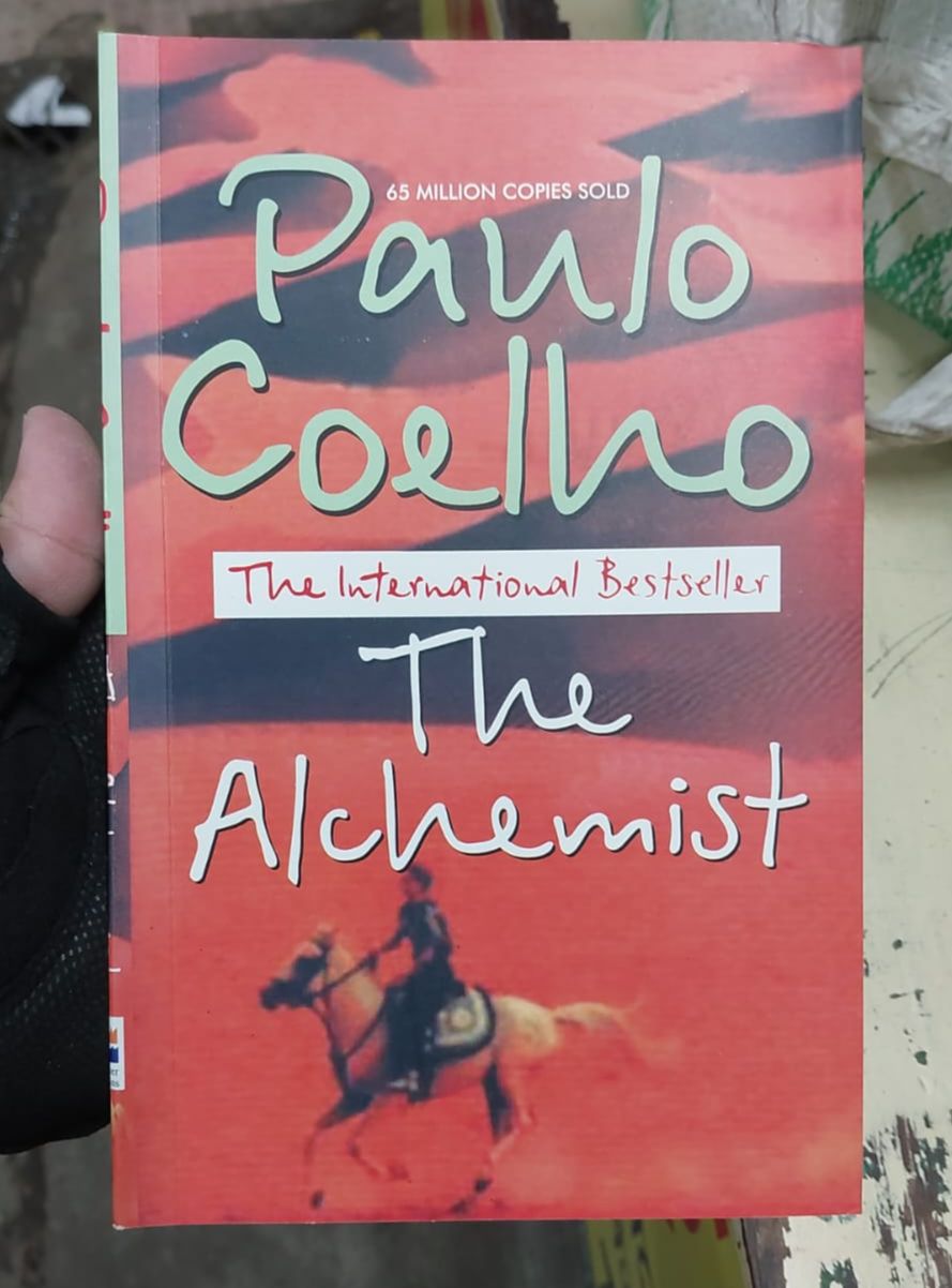 Picture of The Alchemist by Paulo Coelho  - Yellow - Paperback