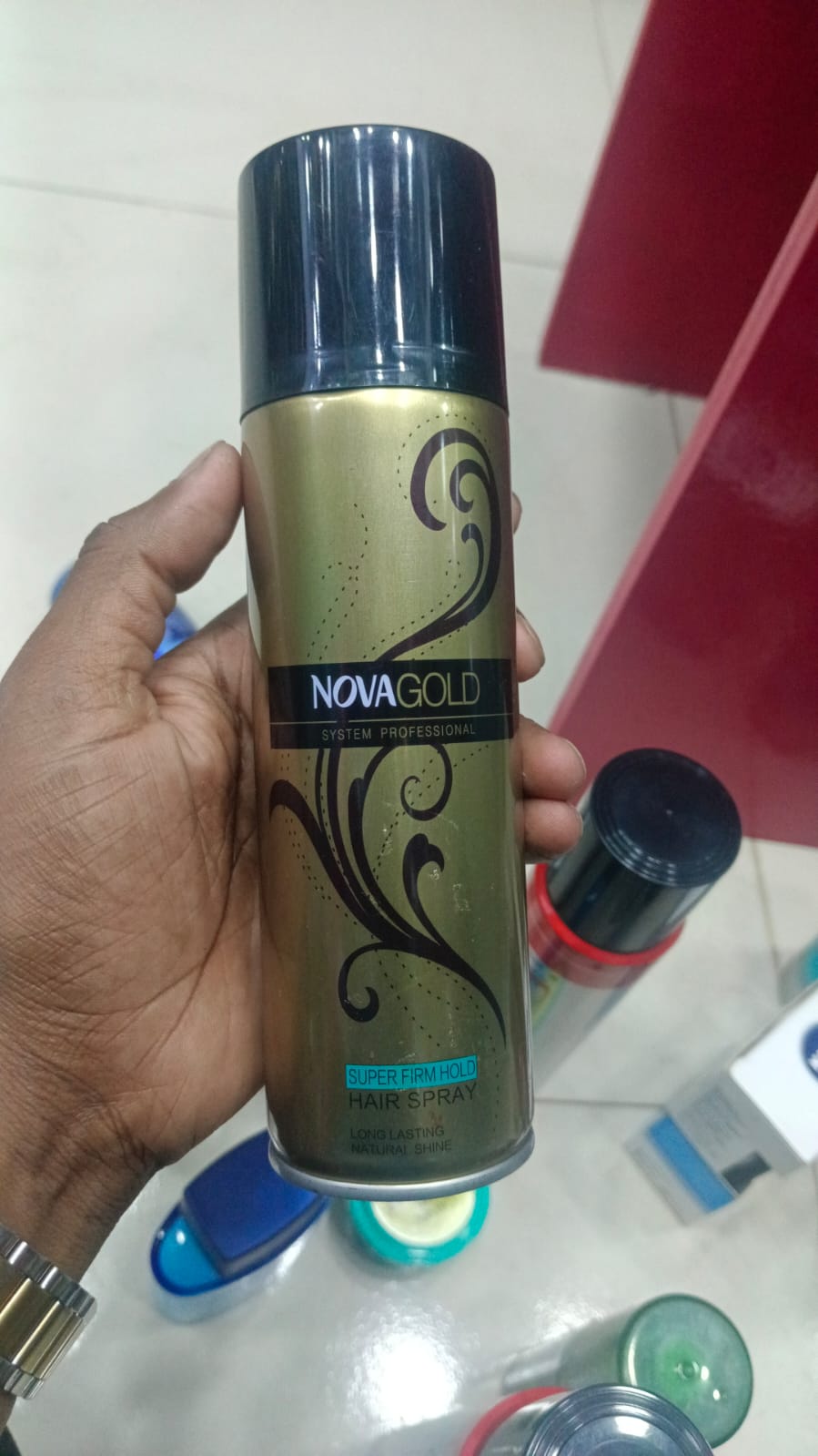Picture of 200 ml Nova Gold Super firm Hold hair spray International UAE product used for male female
