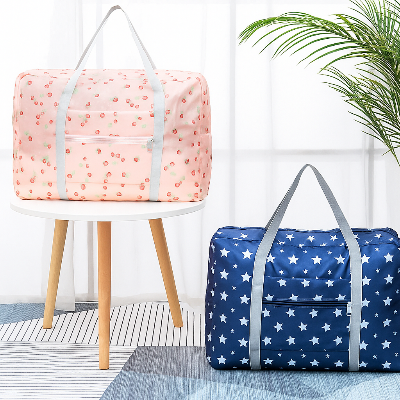 Picture of Foldable Travel Duffel Bag – Lightweight, Waterproof, Spacious | With Front Zipper Pocket & Durable Handles | Available in Cute Cherry & Star Prints – Ideal for Travel, Gym, Shopping(PFTB 01)