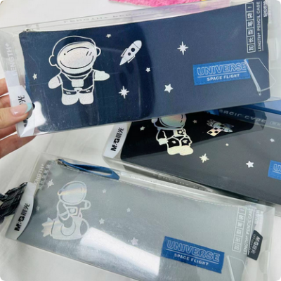 Picture of Morning light flies to the universe inverted trapezoid pencil case male astronaut stationery bag cartoon large capacity dirty stationery pencil case