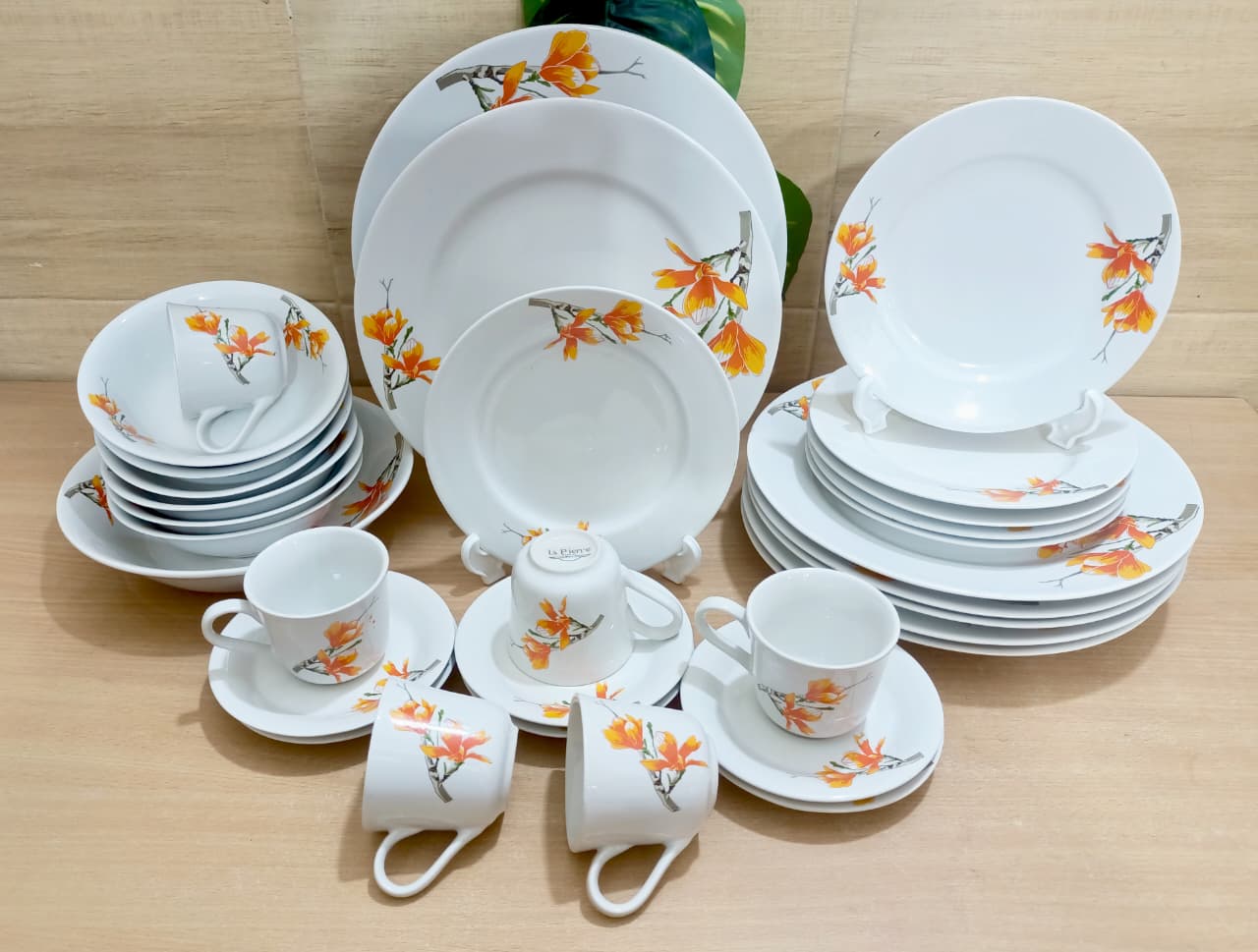 Picture of 32 piece  white orange ceramic dinner set premium quality dinner set