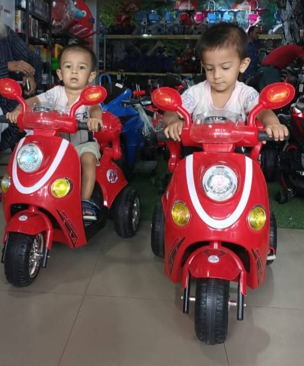 Picture of Kids Rechargeable Scooty Electric Bike with Key Start, Hand Pickup, Foot Brake, Music & LED Lighting Wheels –12V Battery Powered & Double Motor Ride-On Motorcycle for Children Age 4–15 Years