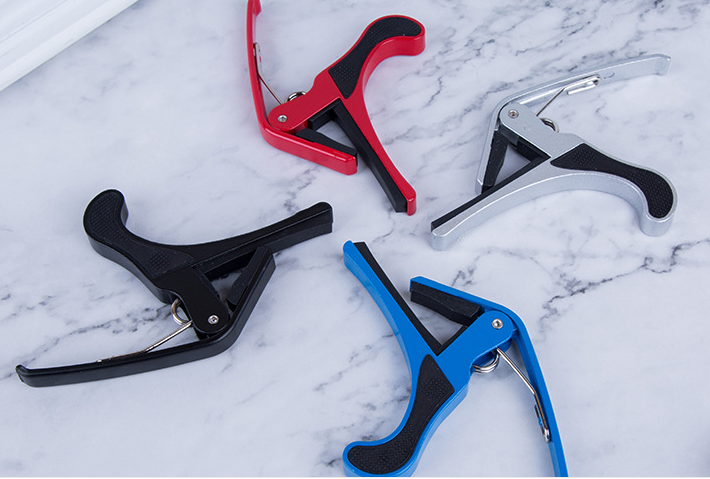 Picture of Tri-Action Capo, Black-For 6-String Electric and Acoustic Guitars-Micrometer tension adjustment for buzz-free, in-tune performance-One-handed use-Integrated pick holder - guitar accessorie