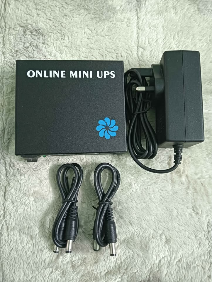 Picture of Mini UPS  For Router Onu etc Backup 5 Hours Plus Minas With 6000mAh Battery And 6 Month Seller Warranty
