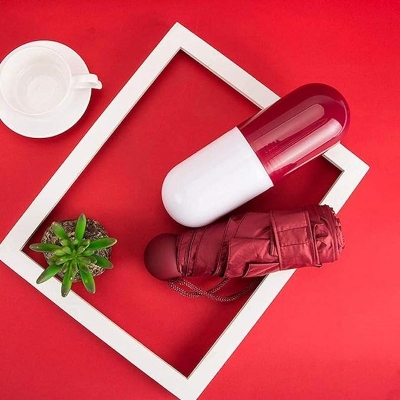 Picture of Folding Umbrella With Cute Capsule Case - Sky Blue Color - Portable Umbrella For Rainy Days