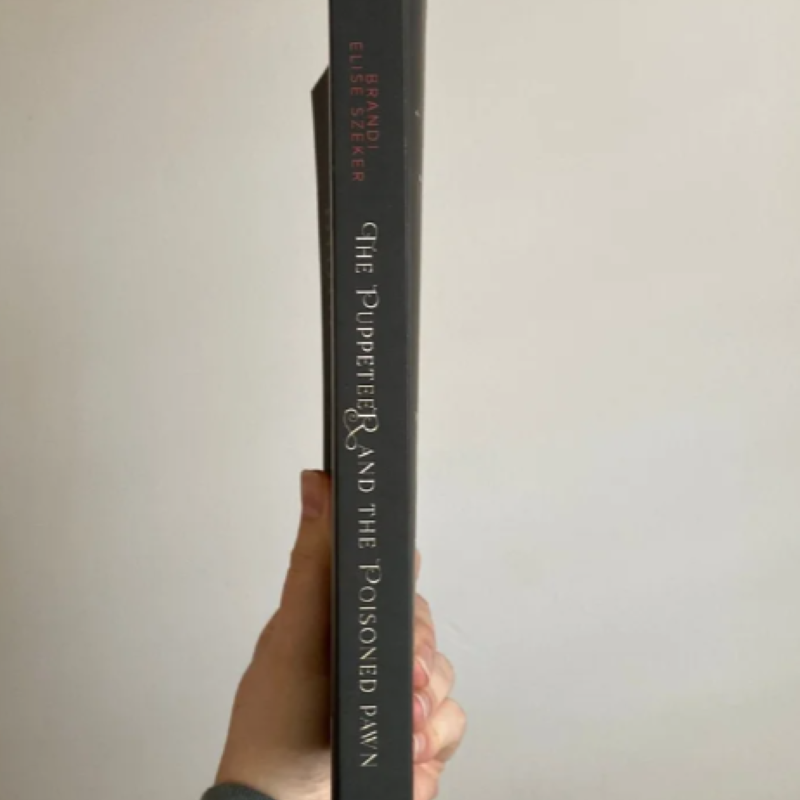 Picture of The Puppeteer and The Poisoned Pawn ( The Pawn and The Puppet #3 ) ( Book by Brandi Elise Szeker ) ( Premium Paper and Matte Cover ) Novel