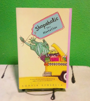 Picture of Shopaholic Takes Manhattan ( Shopaholic #2 ) ( Book by Sophie Kinsella ) ( Premium Paper and Matte Cover ) Novel