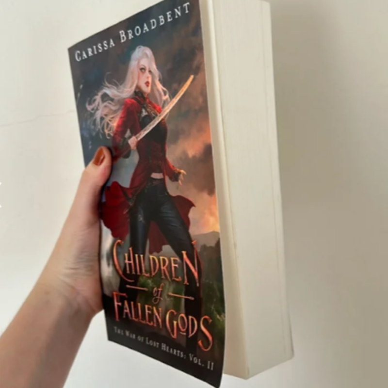 Picture of Children of Fallen Gods ( The War of Lost Hearts #2 ) ( Book by Carissa Broadbent ) ( Premium Paper and Matte Cover ) Novel