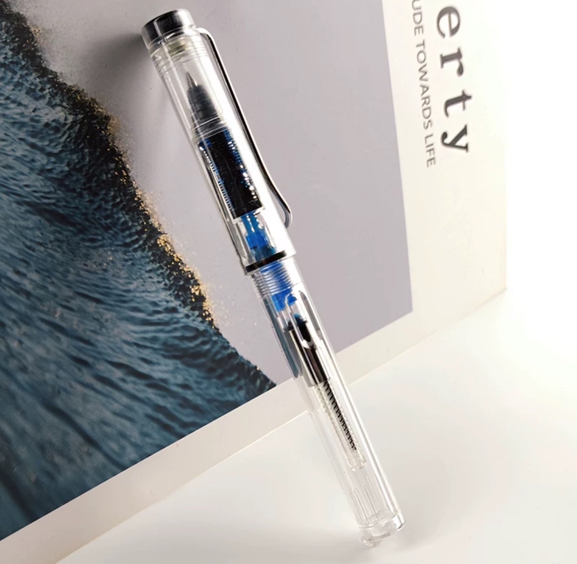 Picture of New piston ink Jel Pen Creative Can Absorb Ink Roller Ball Pens for Office School Writing Supply Fountain Pen-type Transparent Ballpoint Pen 0.4/0.5mm Creative Can Absorb Ink Roller Ball Pens for Office School Writing Supply