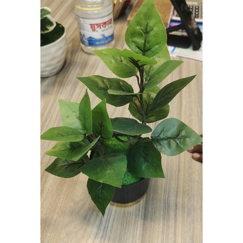 Picture of Artifacial Tree plants with The plant is a small, artificial bonsai-style plant with green leaves in a textured, terracotta-colored pot.