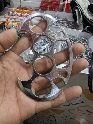 Picture of Photography Old metal brass knuckles knuckledusters with spikes isolated on white background injuries, street fights, fights without rules, urban crime