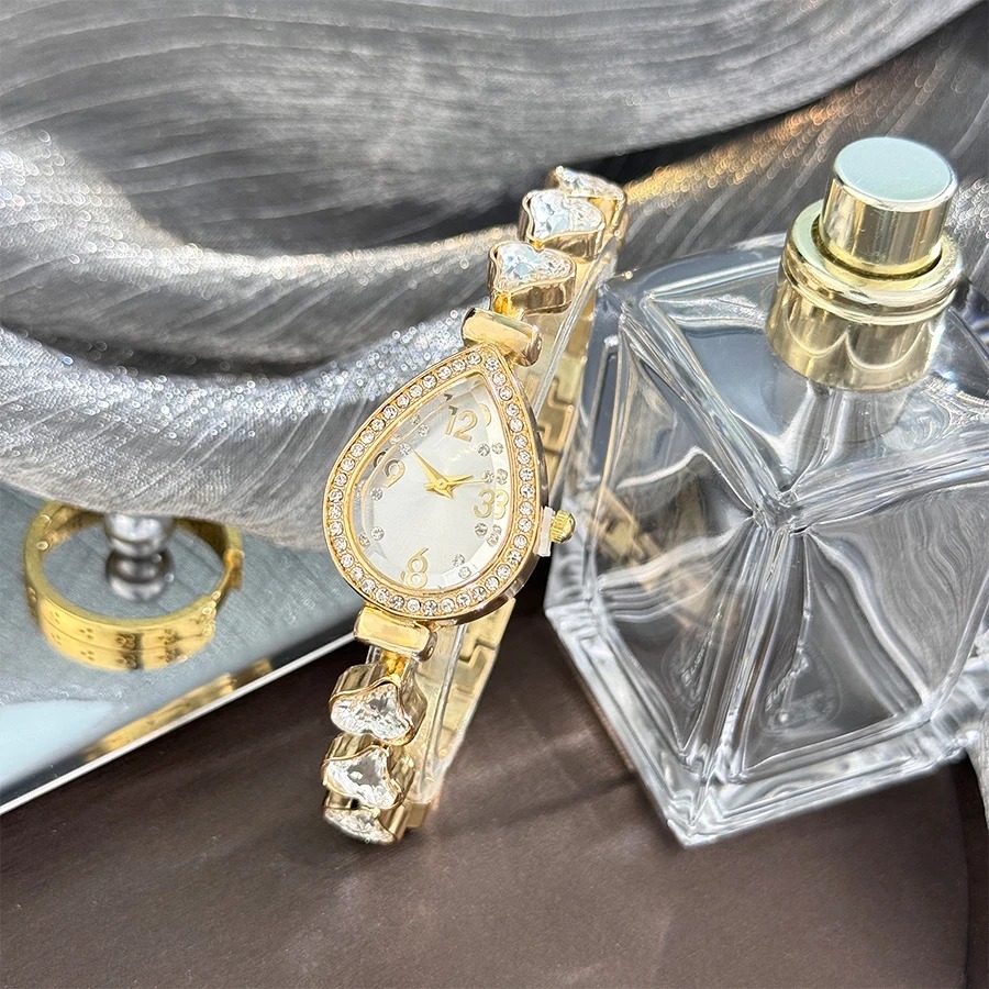 Picture of Elegant freestyle quartz watch for women with embedded diamonds, water drop shaped water box, colorful heart bracelet