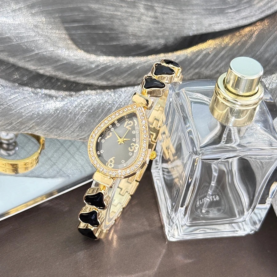 Picture of Elegant freestyle quartz watch for women with embedded diamonds, water drop shaped water box, colorful heart bracelet