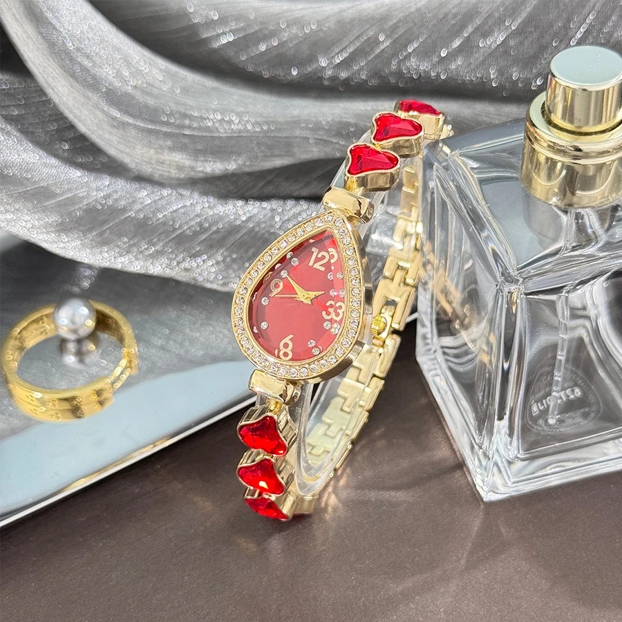 Picture of Elegant freestyle quartz watch for women with embedded diamonds, water drop shaped water box, colorful heart bracelet