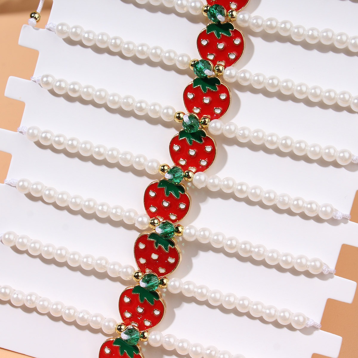 Picture of fashionable imitation pearl beaded red cherry strawberry pendant woven sweet ladies' bracelet