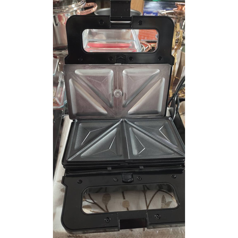 Picture of 3_in_1 Functionality: This appliance includes interchangeable plates for making sandwiches, waffles, and grilling. - Silver