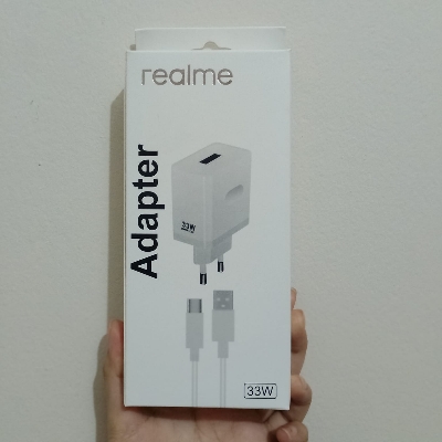 Picture of Realme 33W Super Dart Fast Charging PD Power Adapter, which includes a USB to Type-C cable.