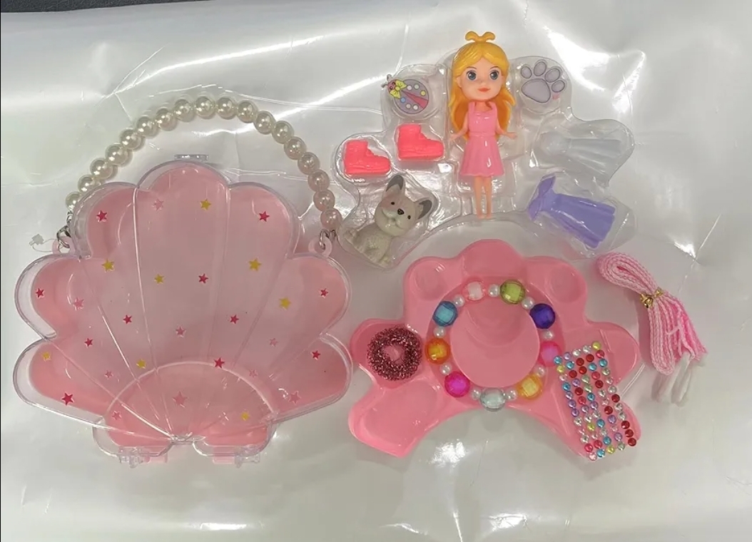 Picture of new collection Plastic Doll Toy with DIY Princess Styling, Featuring Dress, Ring, Bracelet, Necklace Accessories, and A Pet Dog. Creative Doll Styling and Dressing set, Portable shell-shaped bag. For ages 3+