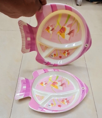 Picture of This colorful Fish Plate Makes Mealtime a fin-tactic Adventure! Divided sections keep portions playful, while the non-slip base helps prevent spills. Made from safe, durable materials, it's perfect for tiny hands and growing appetites