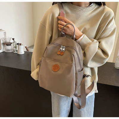 Picture of 2025 New Hot Women's Backpacks Designer High Quality Soft Nylon Simple Fashion Bag(khaki)