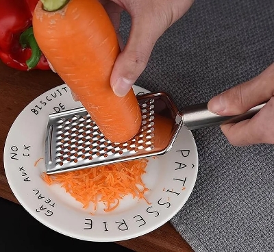 Picture of Stainless Steel Paddle Grater Compact Cheese Grater Lemon Zester Food Shredder Hand Held Kitchen Utensil

 Vegetables peeler slicer Compact And Handy Tool For Grating Vegetables - Silver