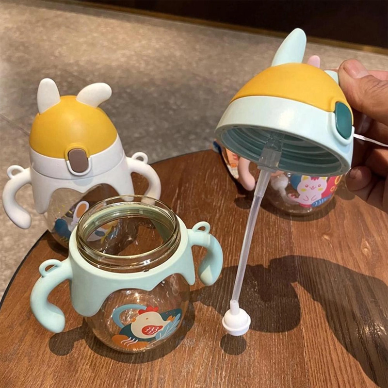 Picture of 350ml Kids Straw Bottle with Gravity Ball Double Handle Drink Leaning Feeding Bottle Sippy Cup Cartoon Printed Water Bottle