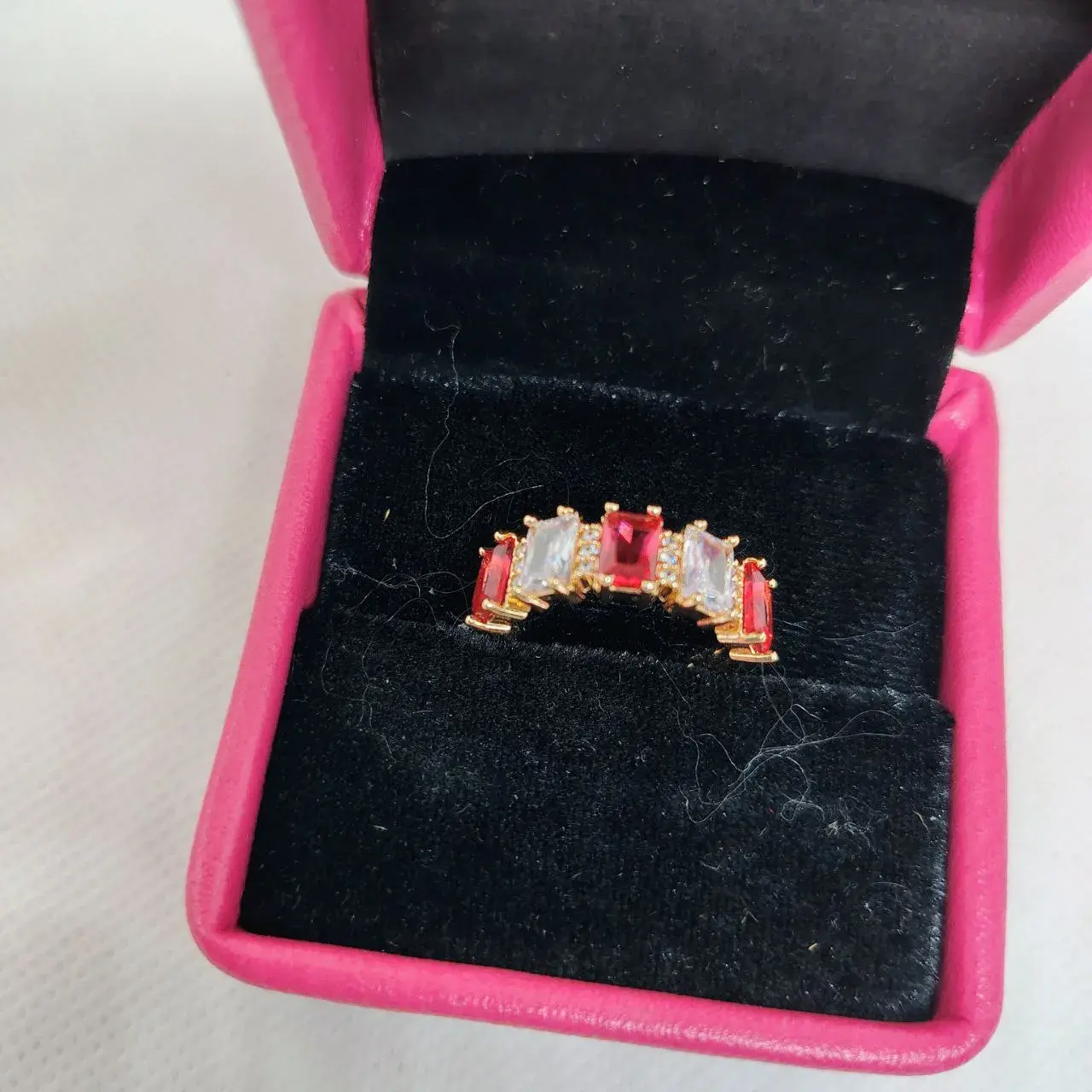 Picture of vibrant gold ring adorned with colorful gemstones