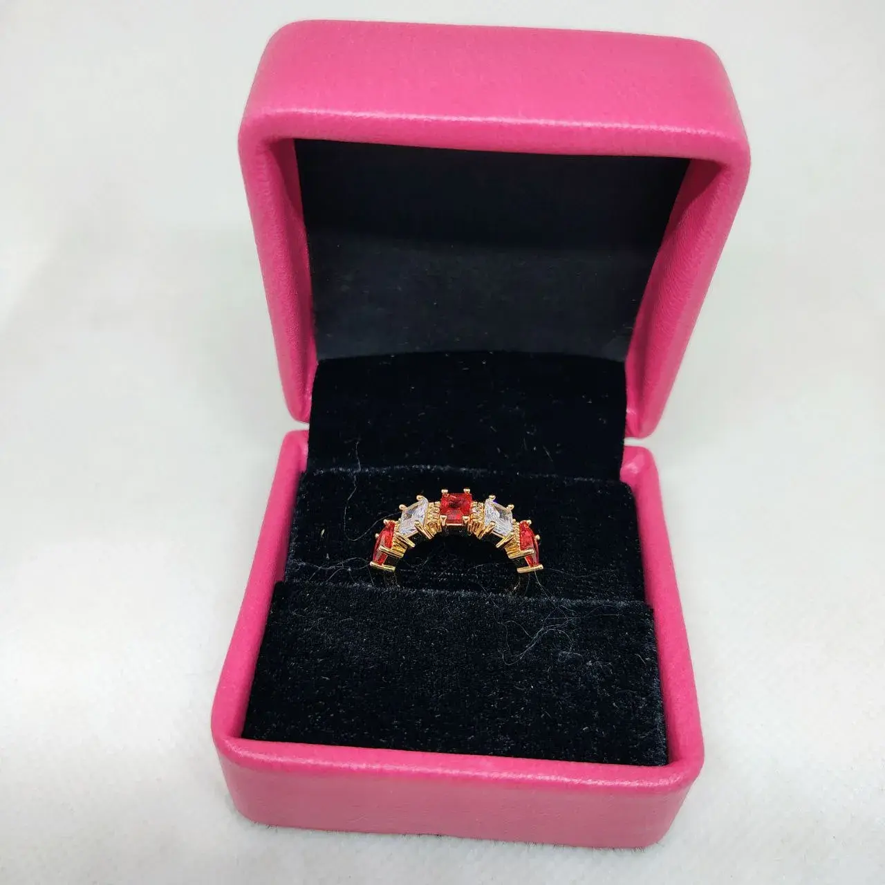 Picture of vibrant gold ring adorned with colorful gemstones