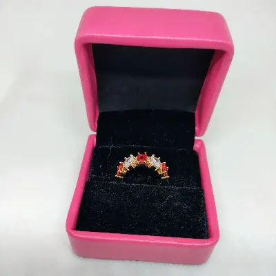 Picture of vibrant gold ring adorned with colorful gemstones
