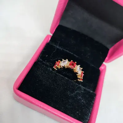 Picture of vibrant gold ring adorned with colorful gemstones