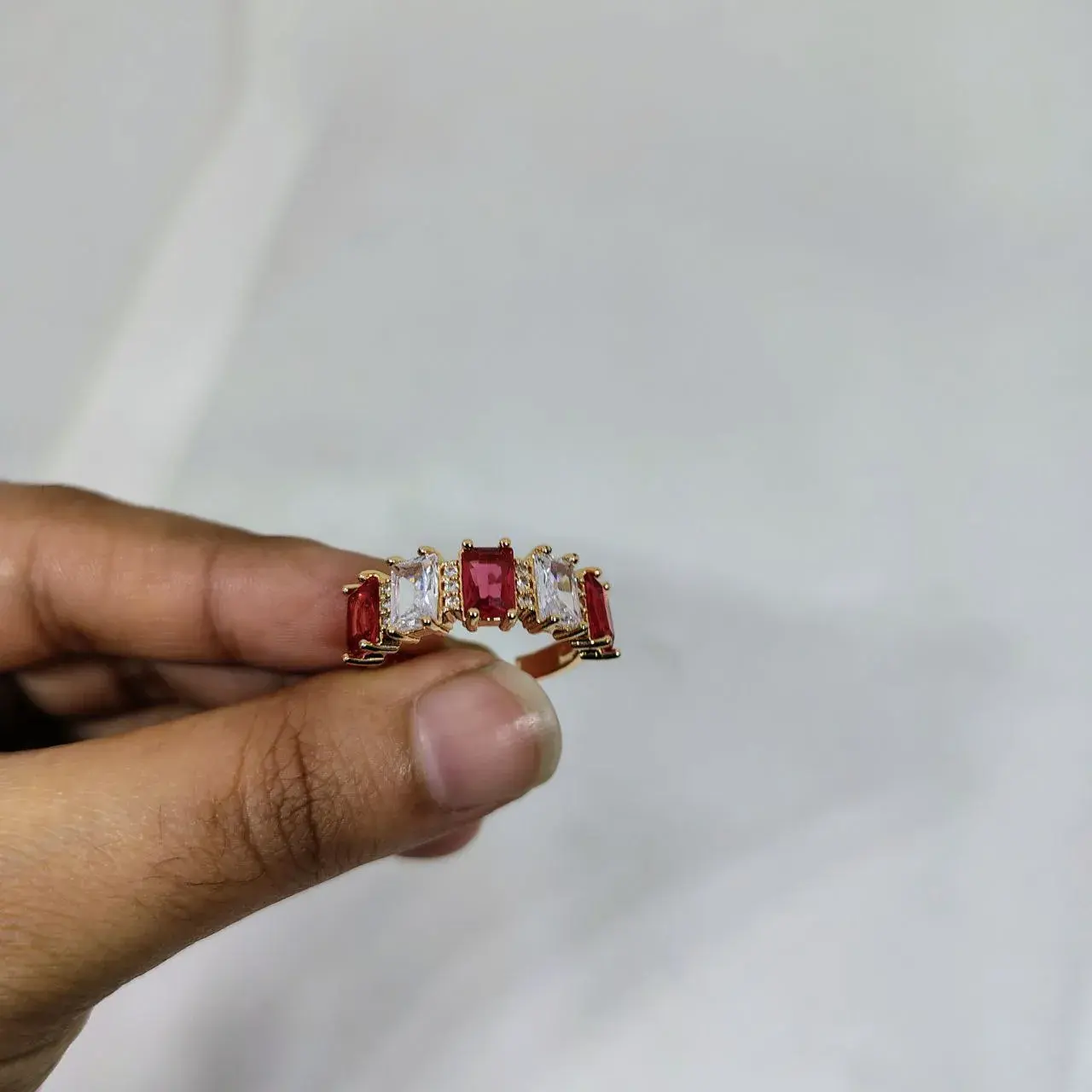 Picture of vibrant gold ring adorned with colorful gemstones