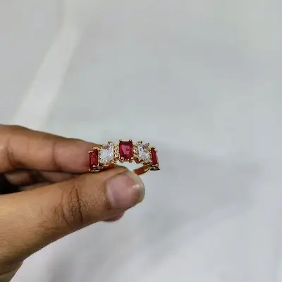 Picture of vibrant gold ring adorned with colorful gemstones